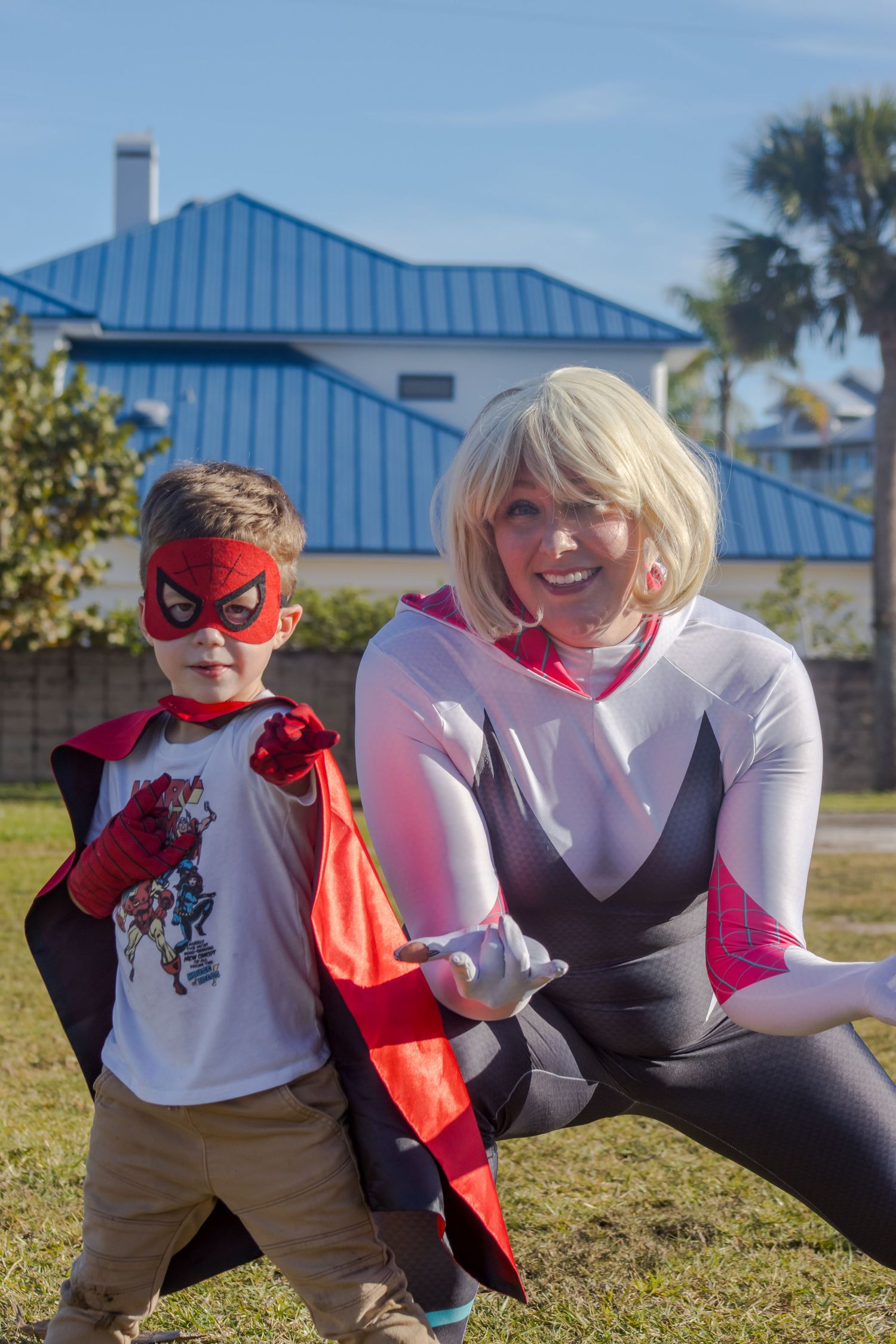 spider-gwen and boy posing