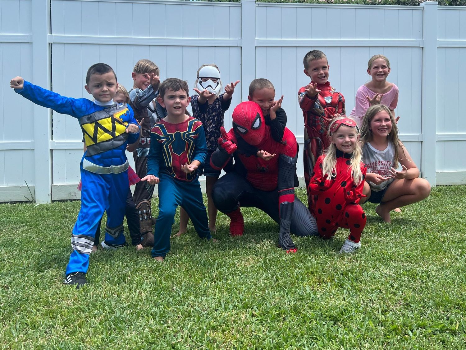 spiderman with young kids at birthday party