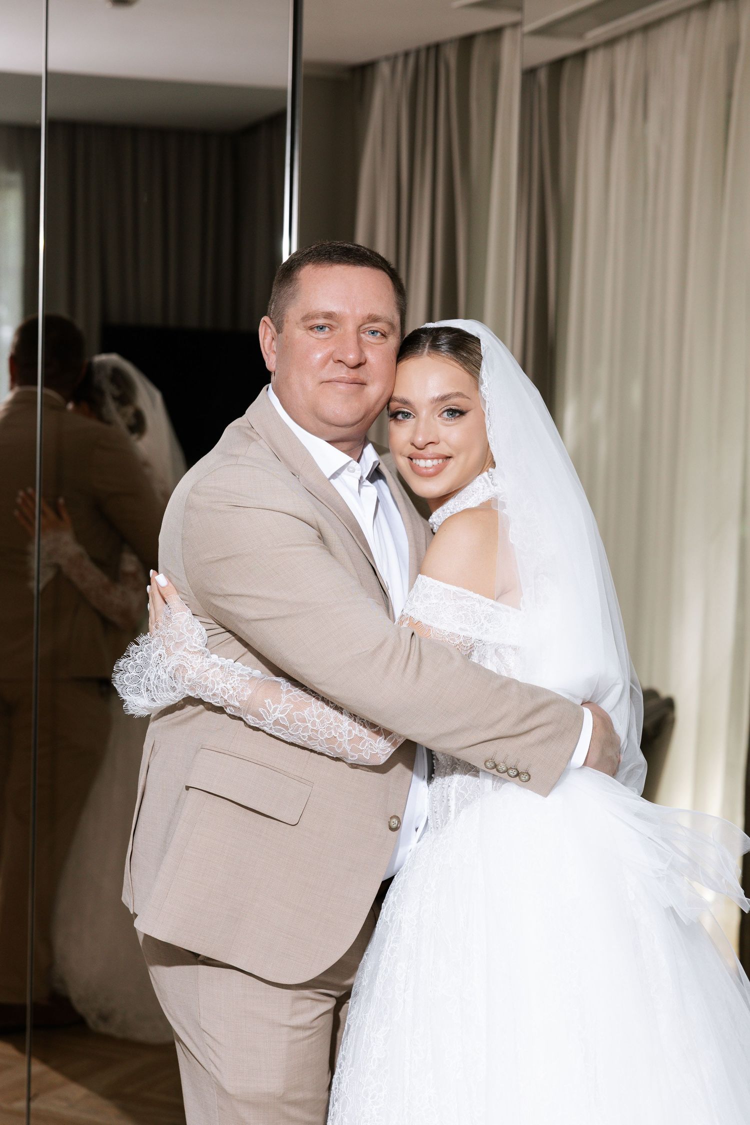 Wedding couple embraces in a series of candid moments, with the groom wearing a beige suit.