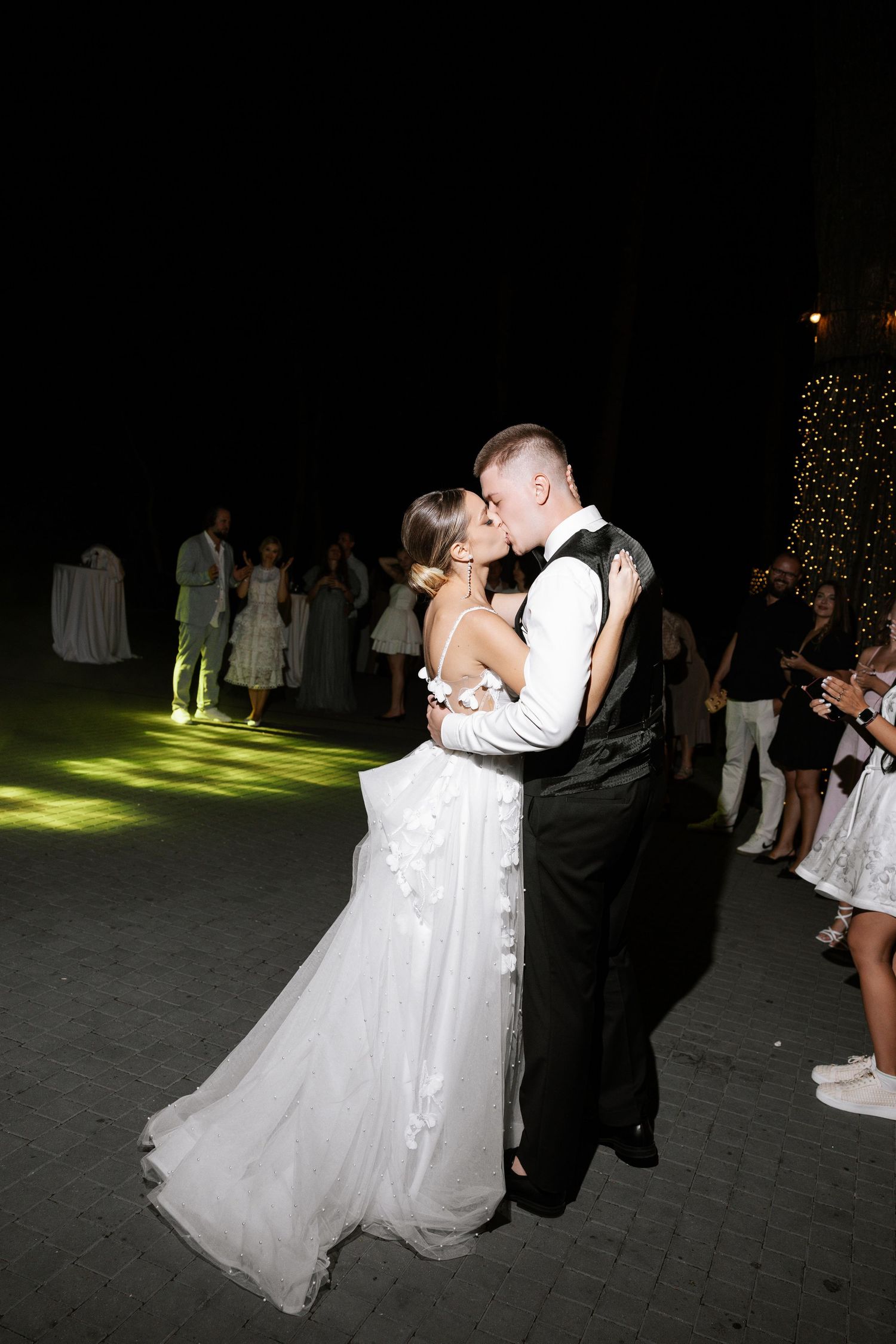 Couple sharing a romantic dance moment at their wedding reception.