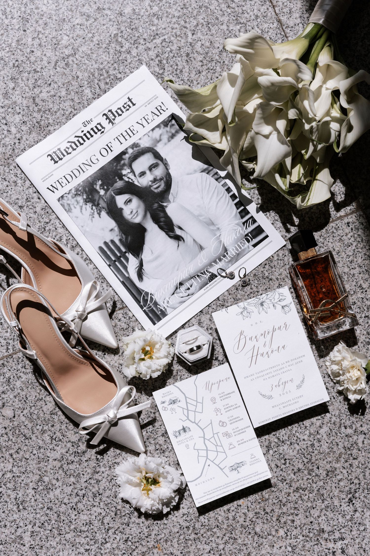 Black and white fashion photographs arranged with white flowers and nude heels on a textured gray surface.