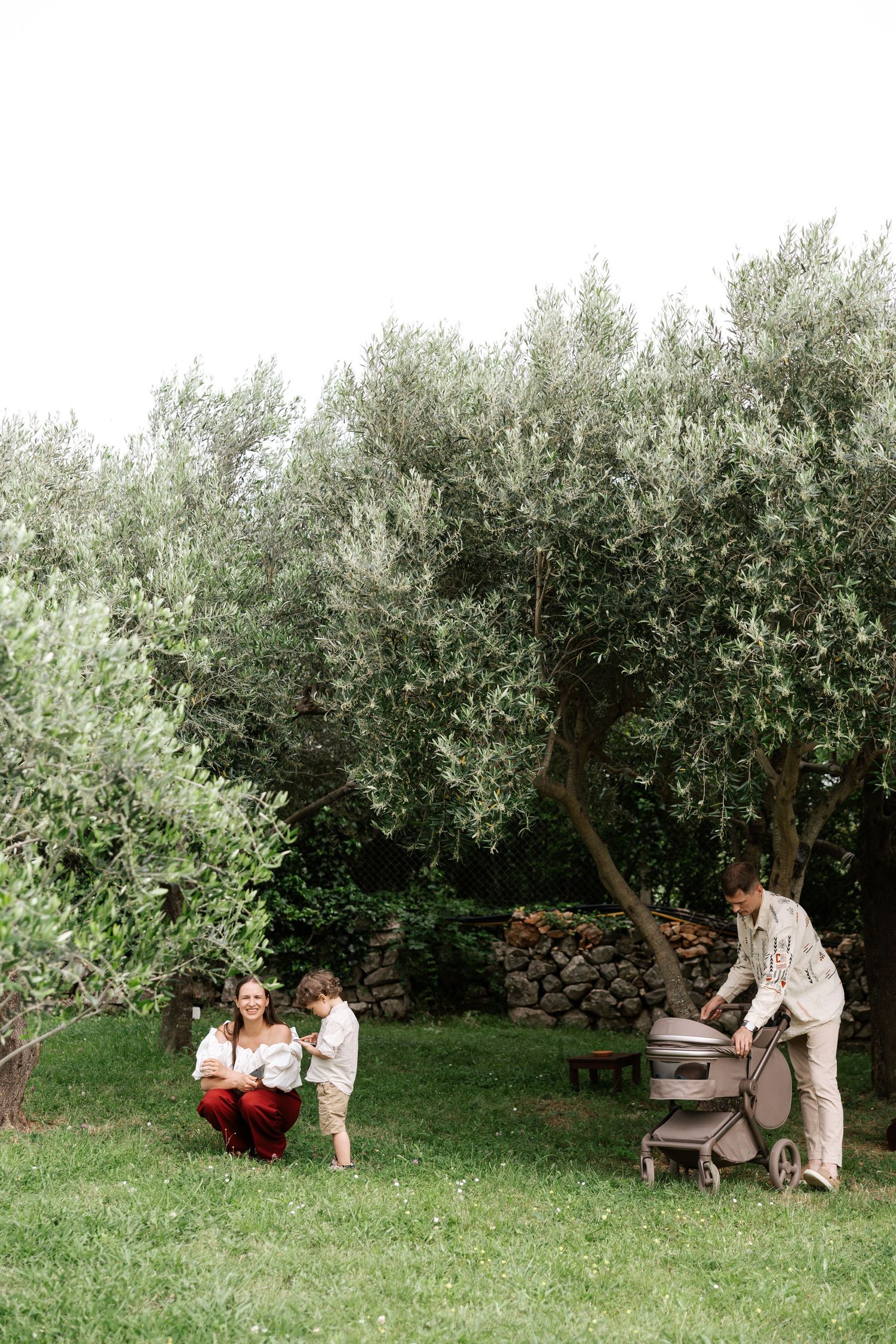 A romantic outdoor piano session unfolds in a serene apple orchard with soft natural lighting.