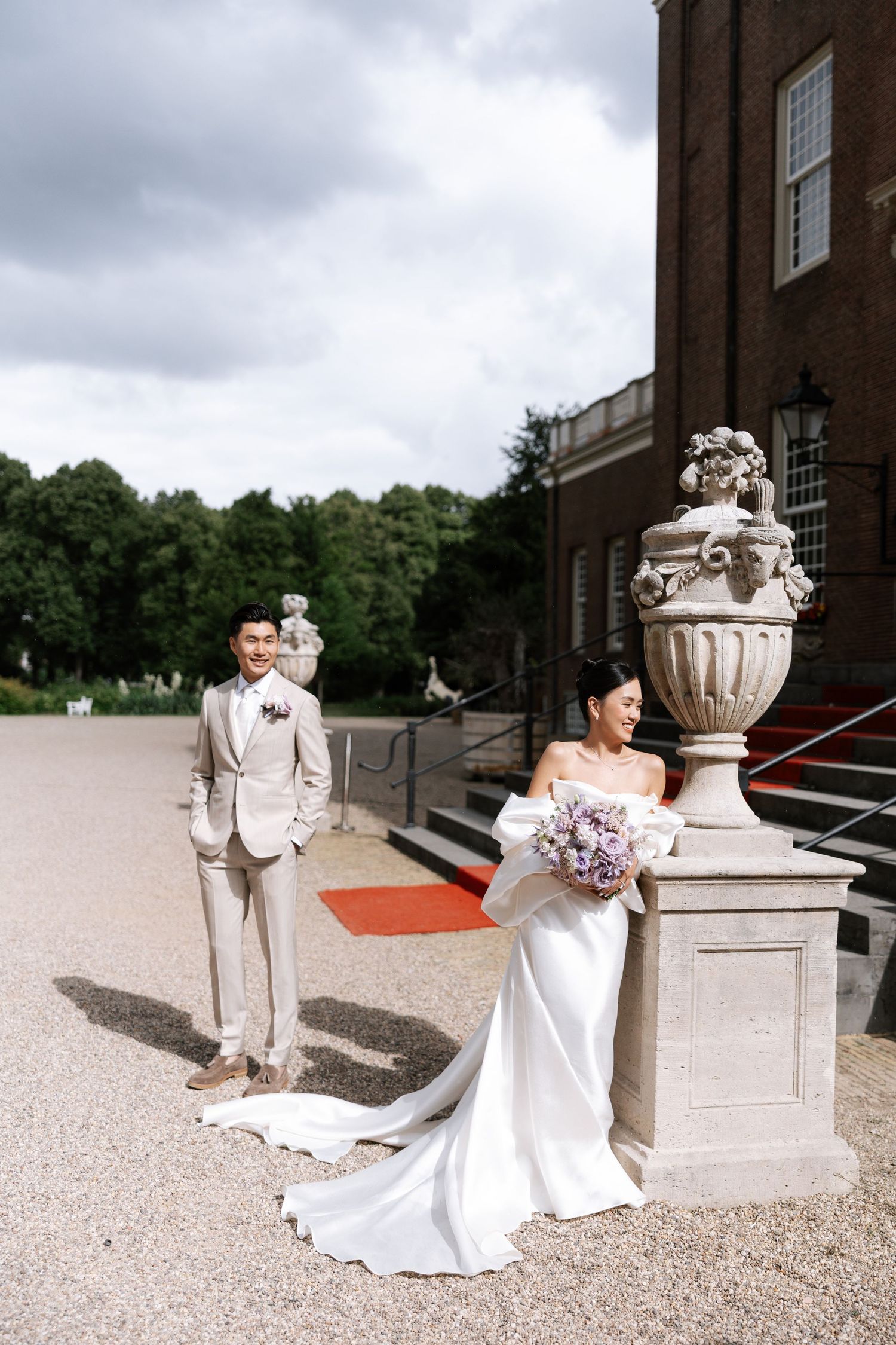 A romantic wedding photo sequence showing the couple in elegant attire posing on a grand estate's gravel path.