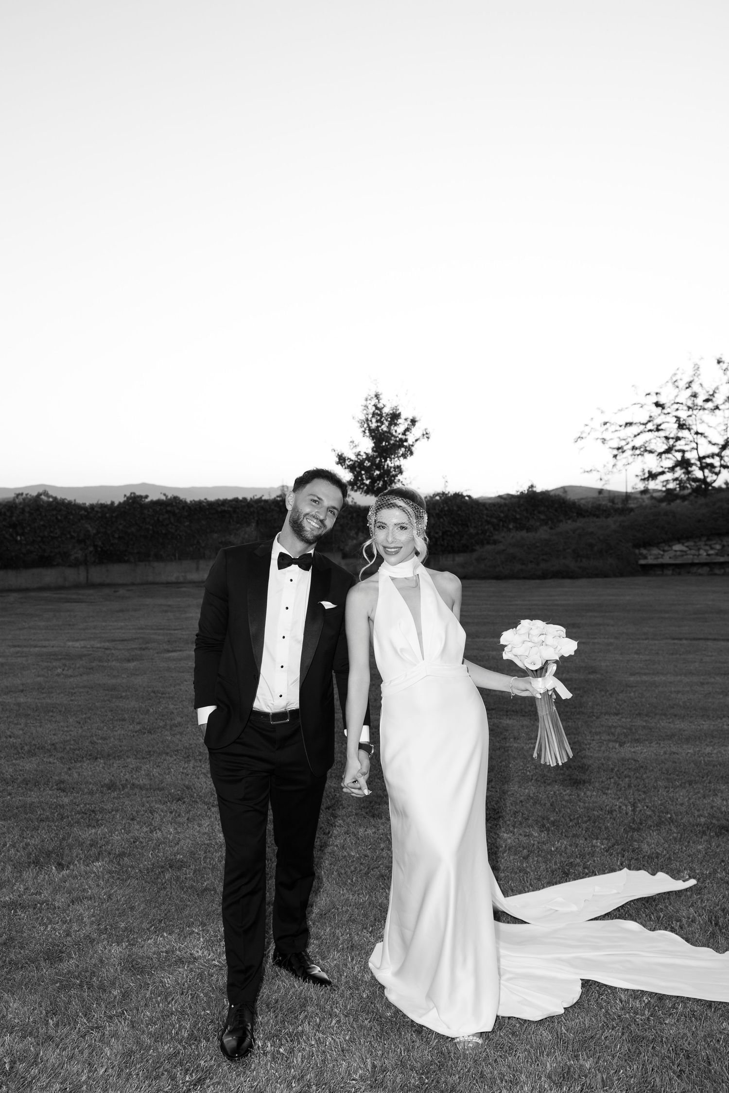 A black and white wedding photo sequence shows a couple walking across an open field with a flowing bridal gown.