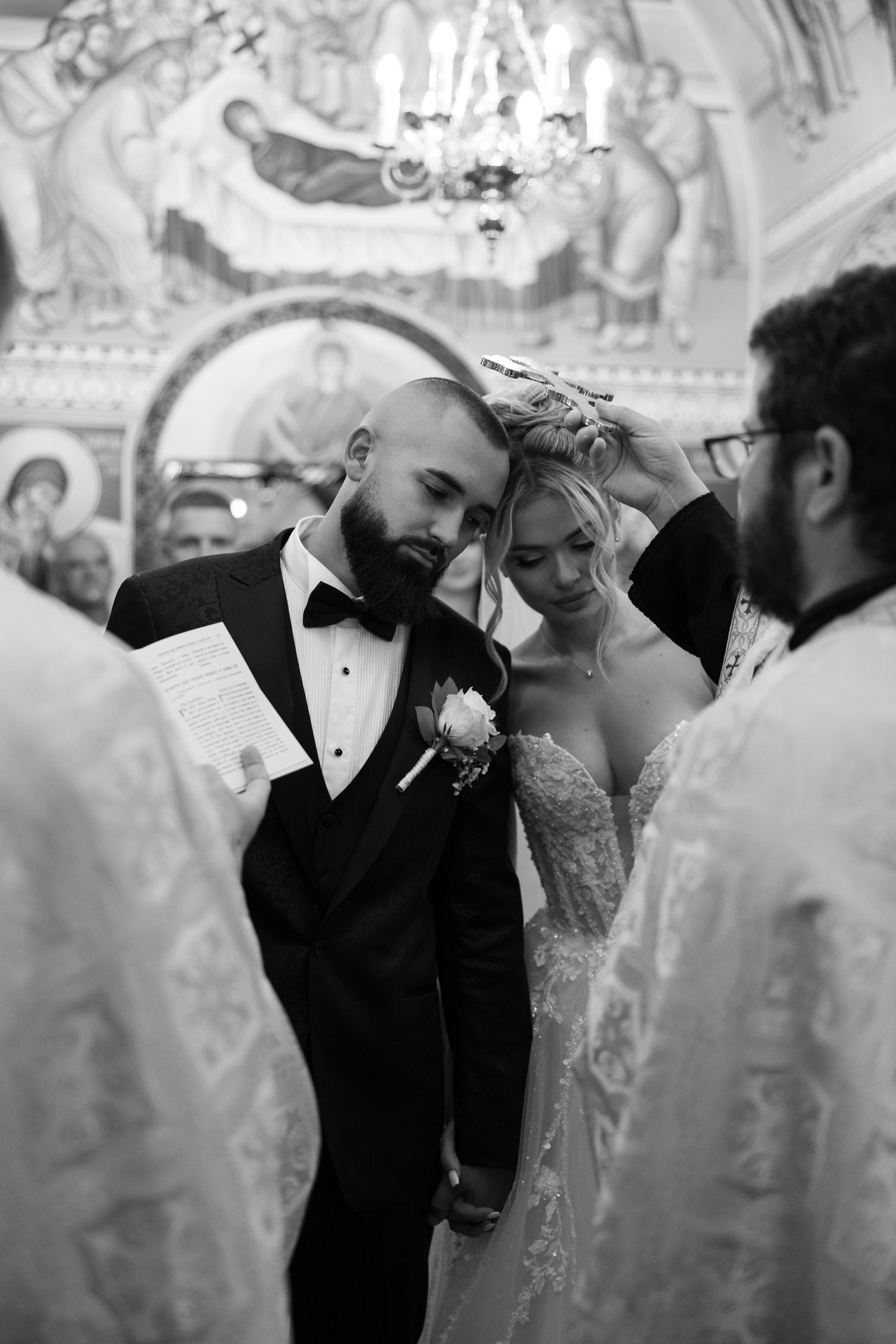 Black and white wedding photo series showing tender moments between a couple during their elegant reception celebration.