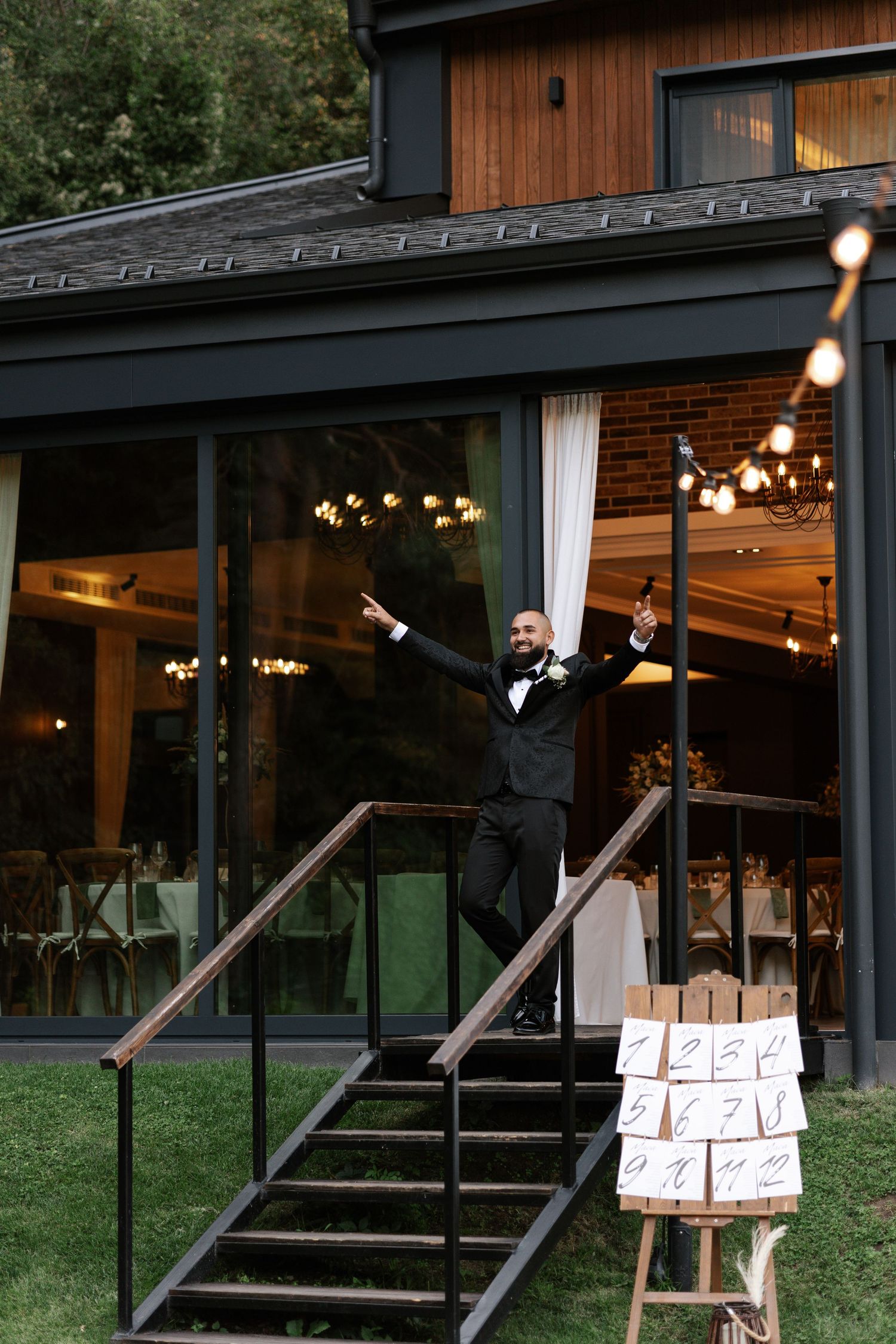 A series of photos showing someone holding pizza boxes while standing on wooden steps outside a rustic building at night.