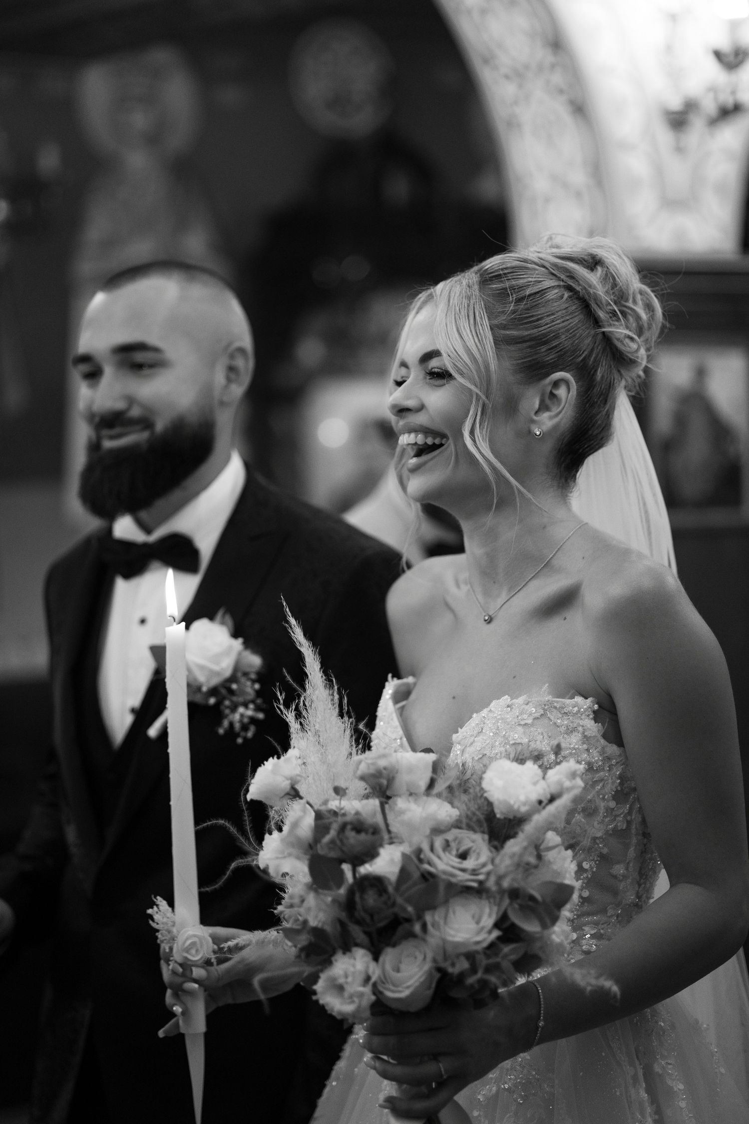 A black and white wedding photo series showing candid moments between newlyweds with flowers and formal attire.