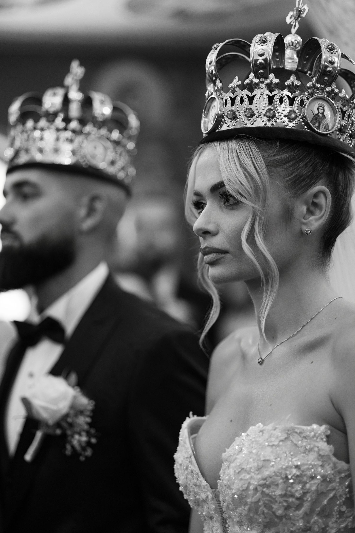 Black and white image showing a series of side profile views of a person wearing an ornate crown and formal dress.