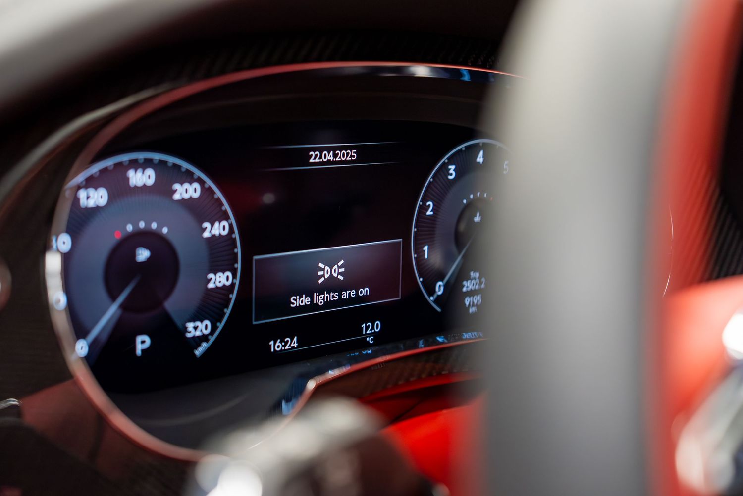 Digital instrument cluster display showing speed and navigation in a modern Bentley vehicle.
