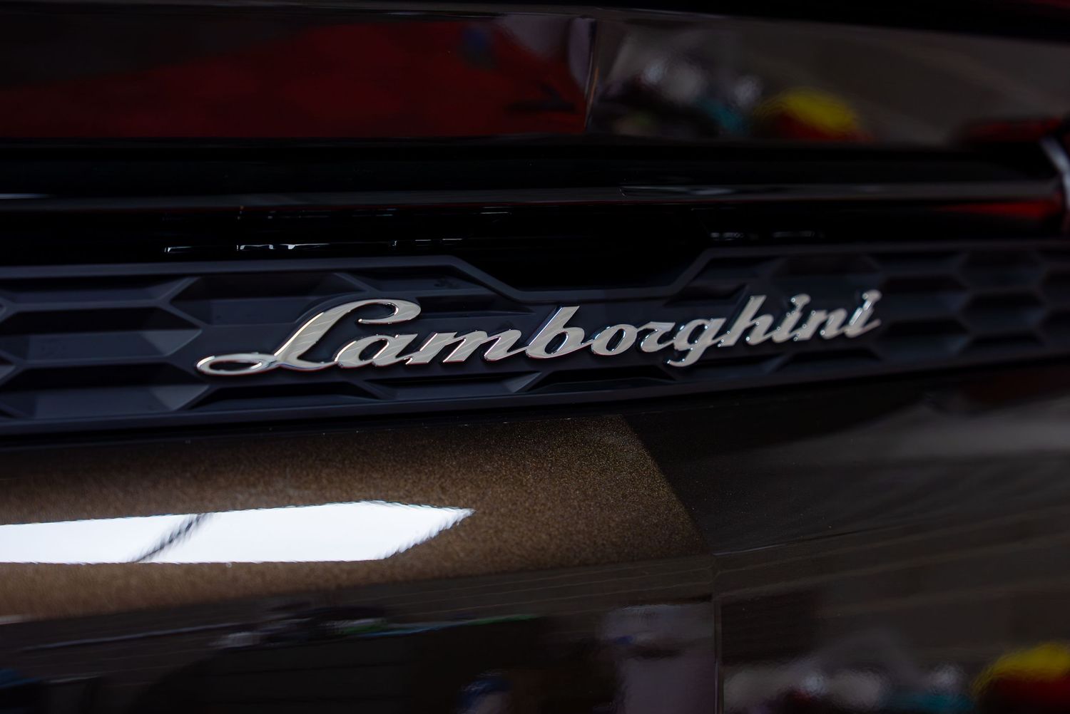 Lamborghini branding and logos displayed on various vehicle surfaces.
