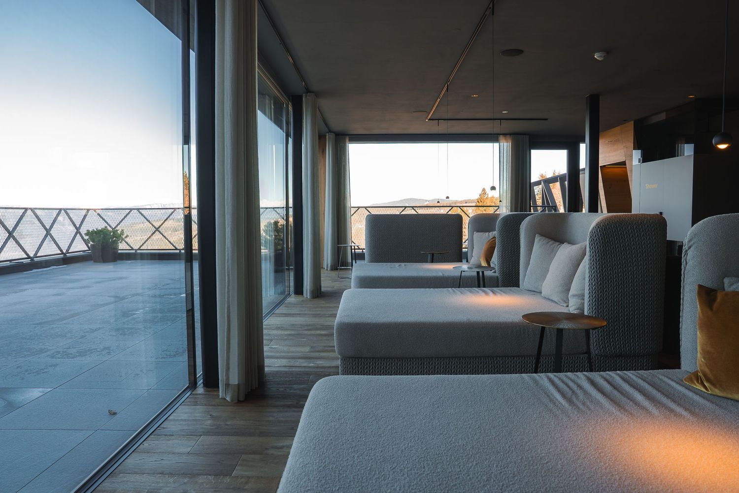 Modern living space with floor-to-ceiling windows offering panoramic views.