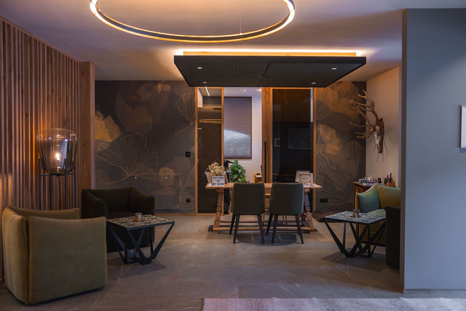 Modern interior space with circular LED ceiling lights and wooden accent walls.