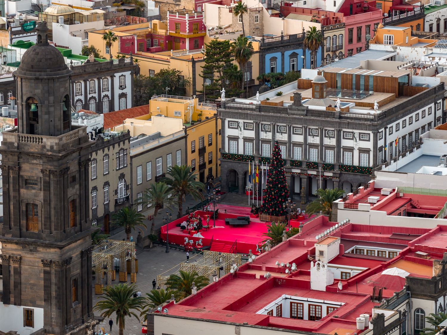 Aerial view of colorful historic buildings and red rooftops in Las Palmas de Gran Canaria, Spain.
