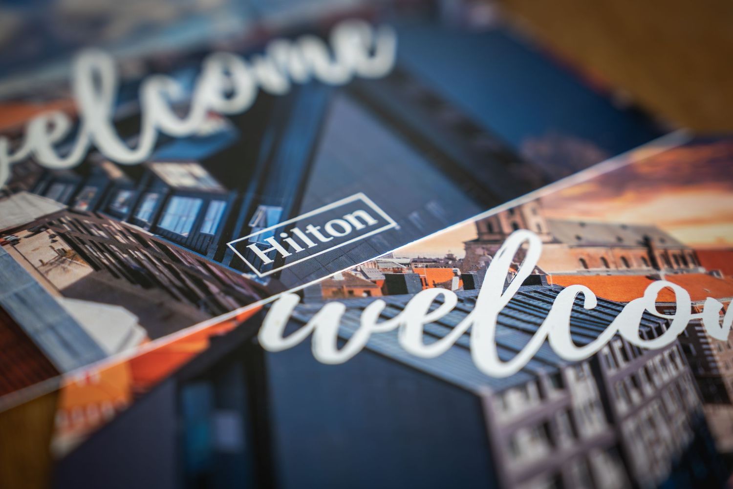 Detail shot of Hilton hotel welcome brochure with stylized typography.