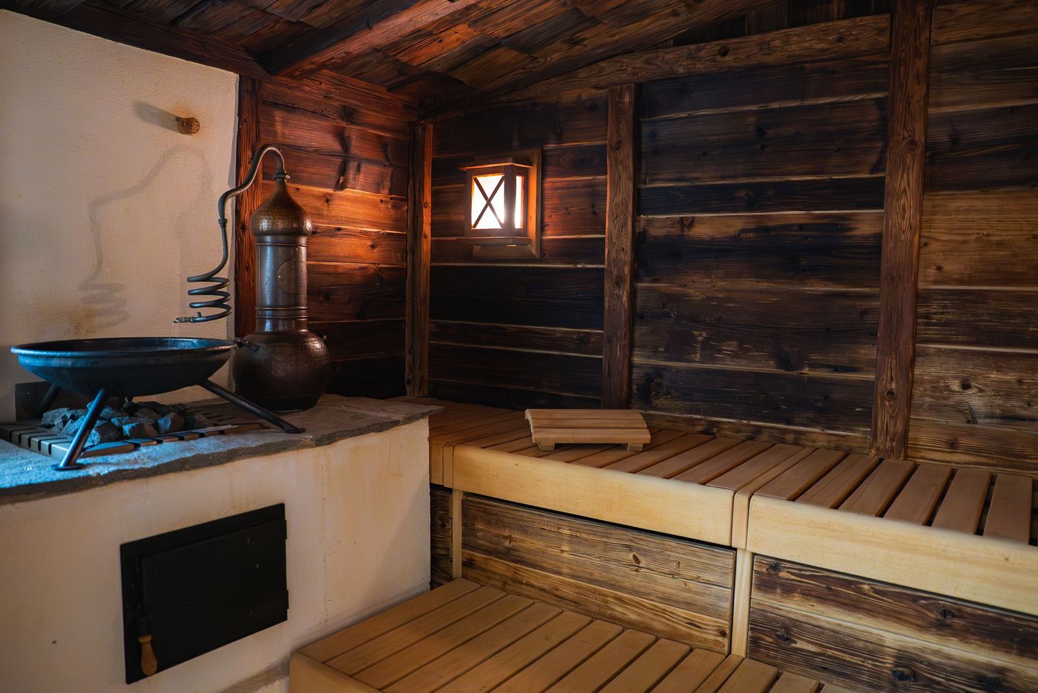 Wooden sauna interior with traditional log construction and bench seating.