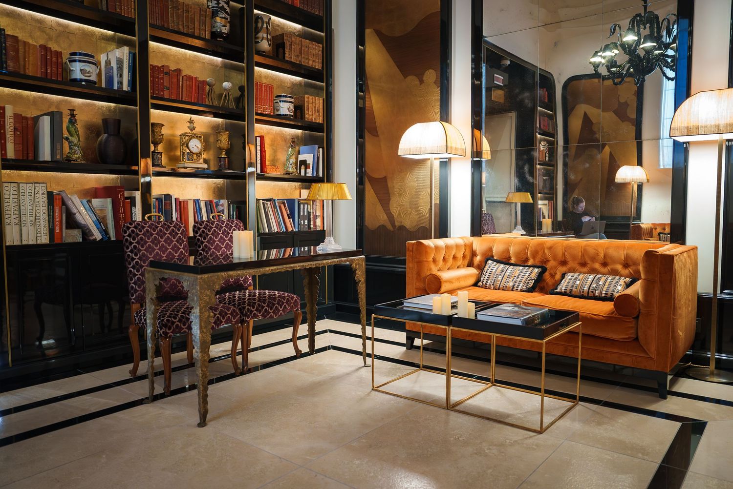 Luxurious lounge area with leather sofas and vintage-style furniture.