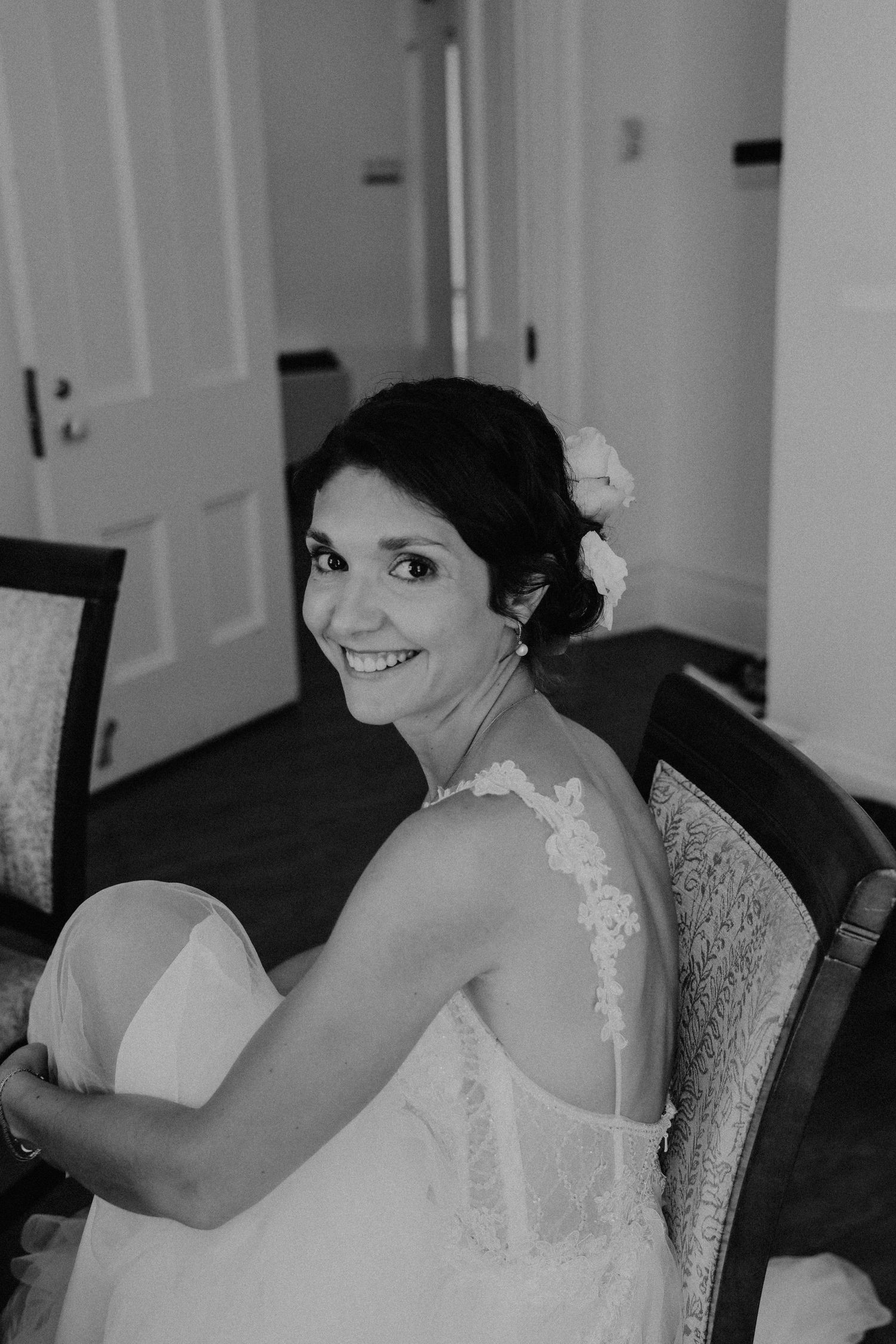 Bride attaching her sandals