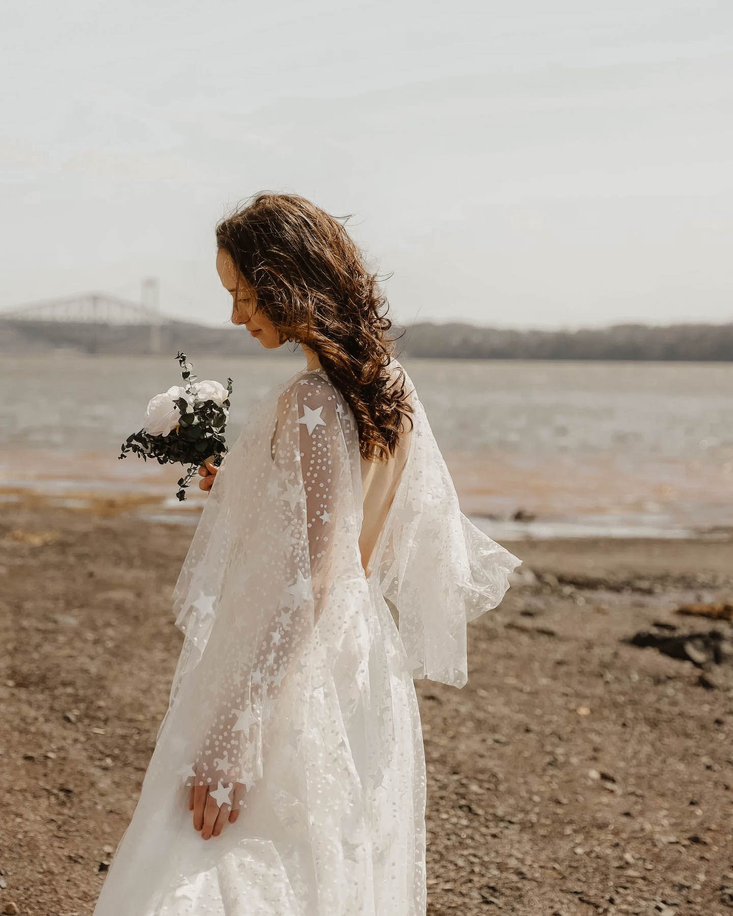 Bride at the beach with a floral dress