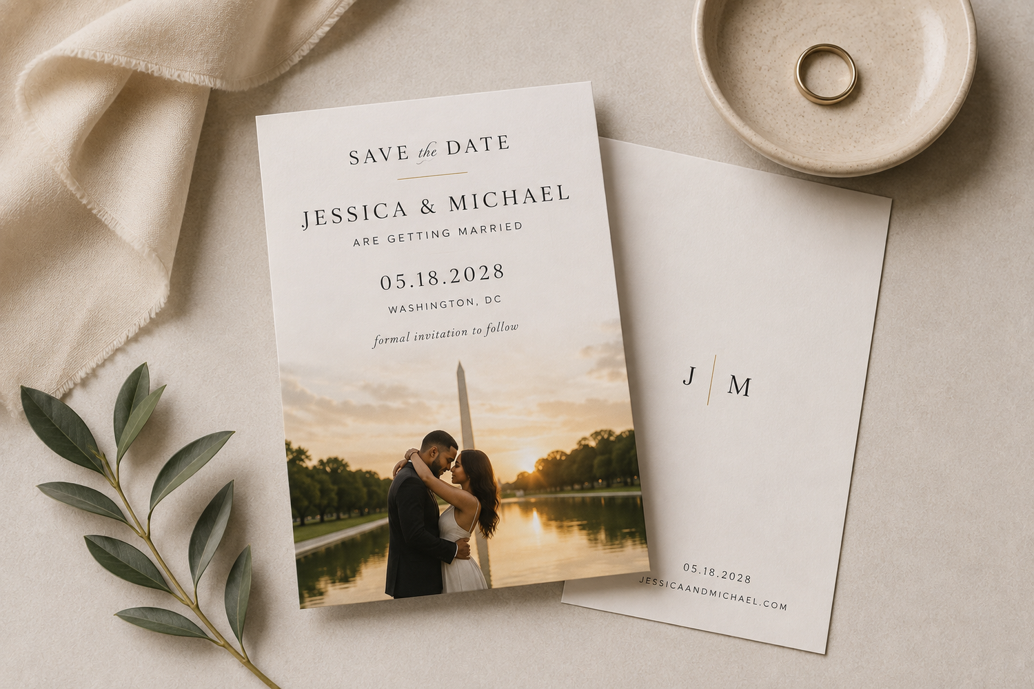 Elegant save the date wedding card featuring couple photo at sunset with Washington DC backdrop, dated 05.18.2028.