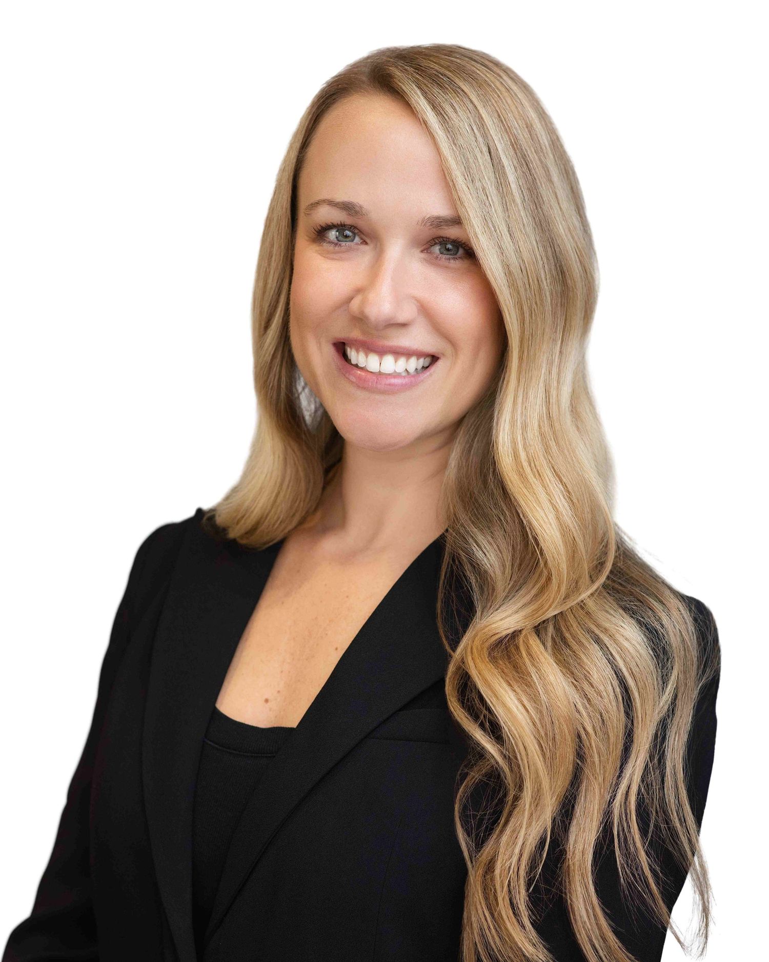 Professional headshot of a smiling blonde woman in a black blazer against a white background.