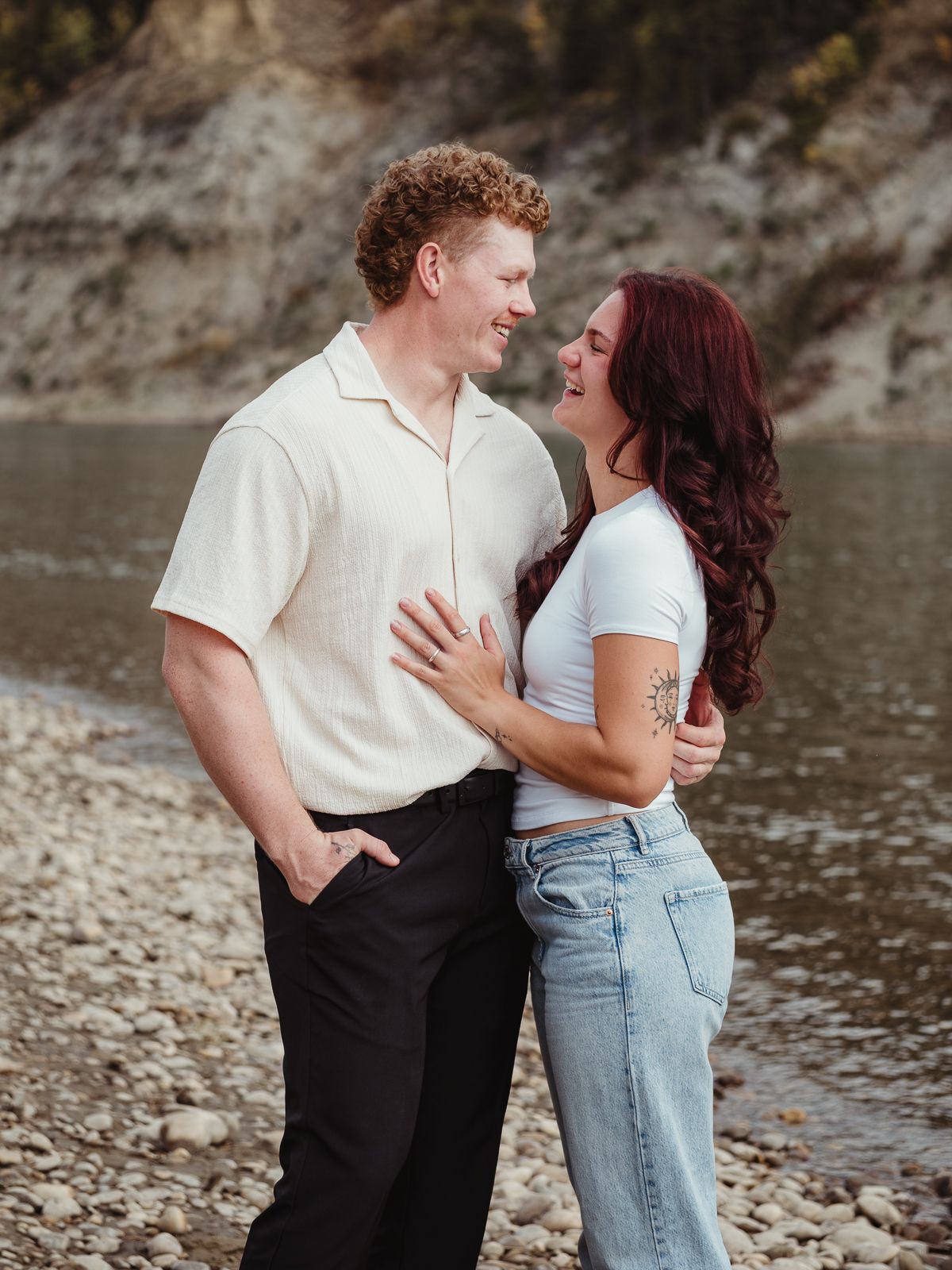 Couple cuddling during outdoor photography session