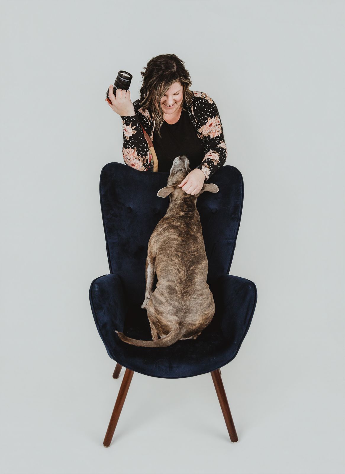 Emotional connection between photographer and rescue dog during a studio pet photography session in the Edmonton area.
