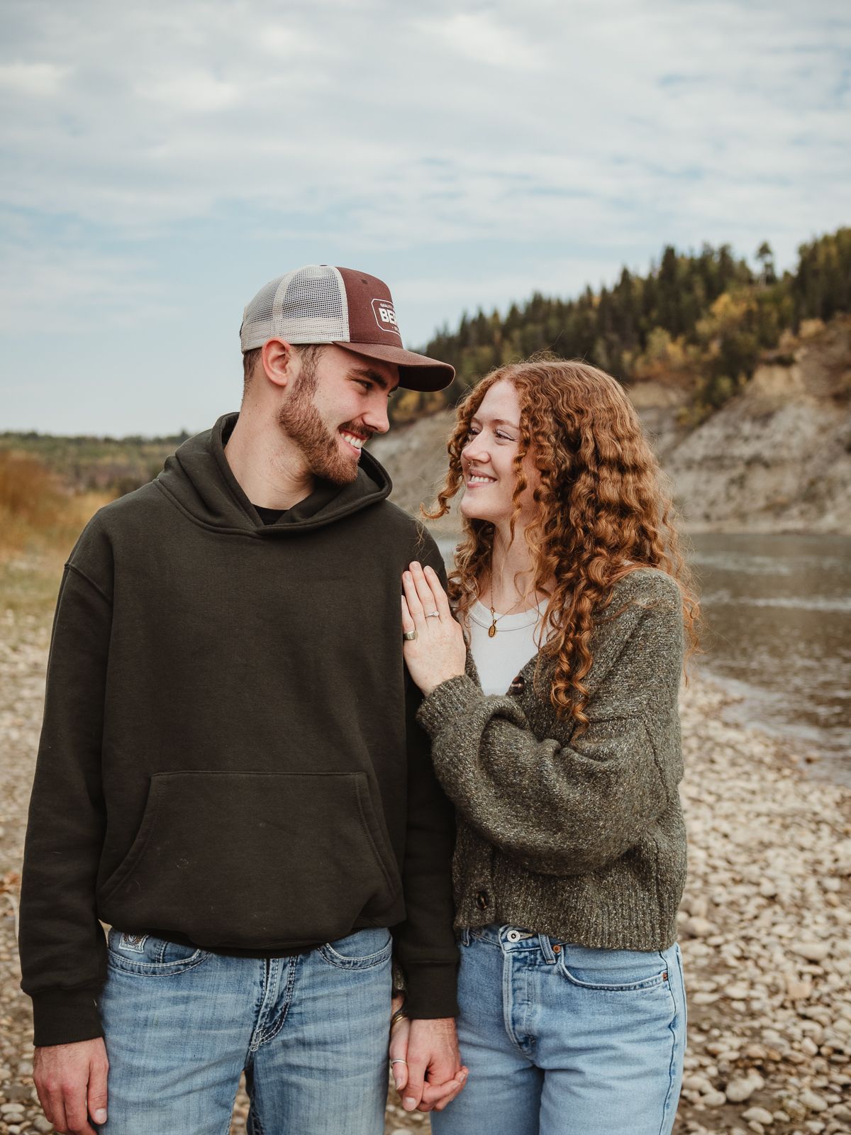 Couple cuddling during outdoor photography session