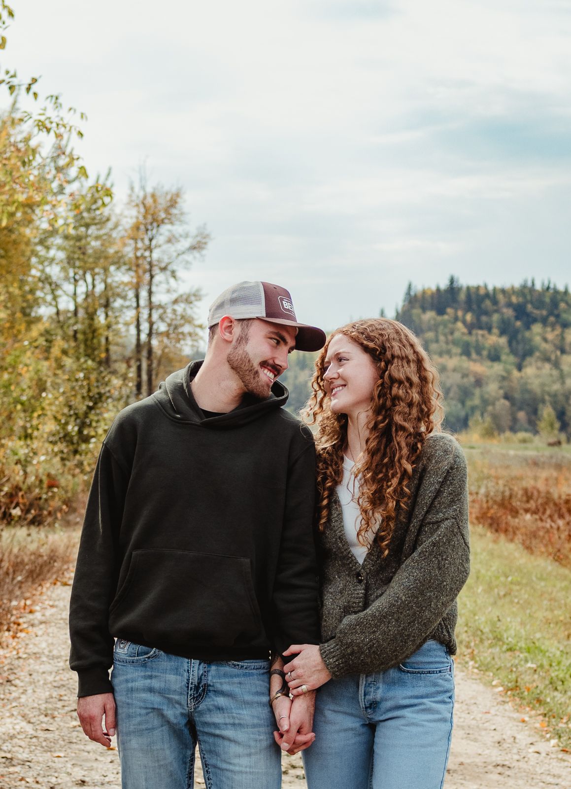 Couple cuddling during outdoor photography session