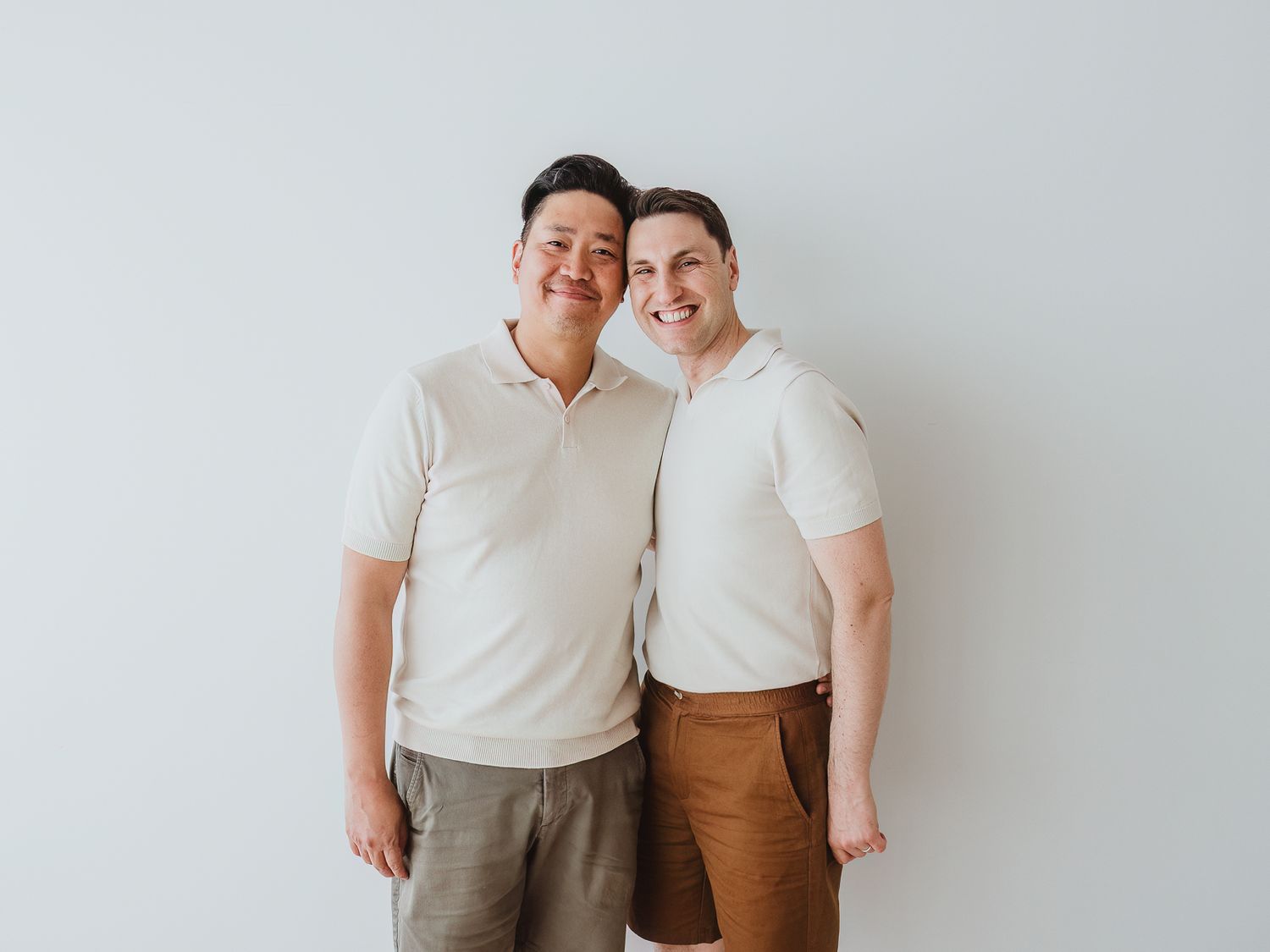 Couple smiling together during an extended family photography session with a Spruce Grove family photographer.