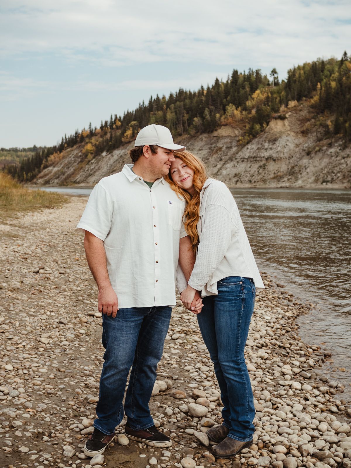 Couple cuddling during outdoor photography session