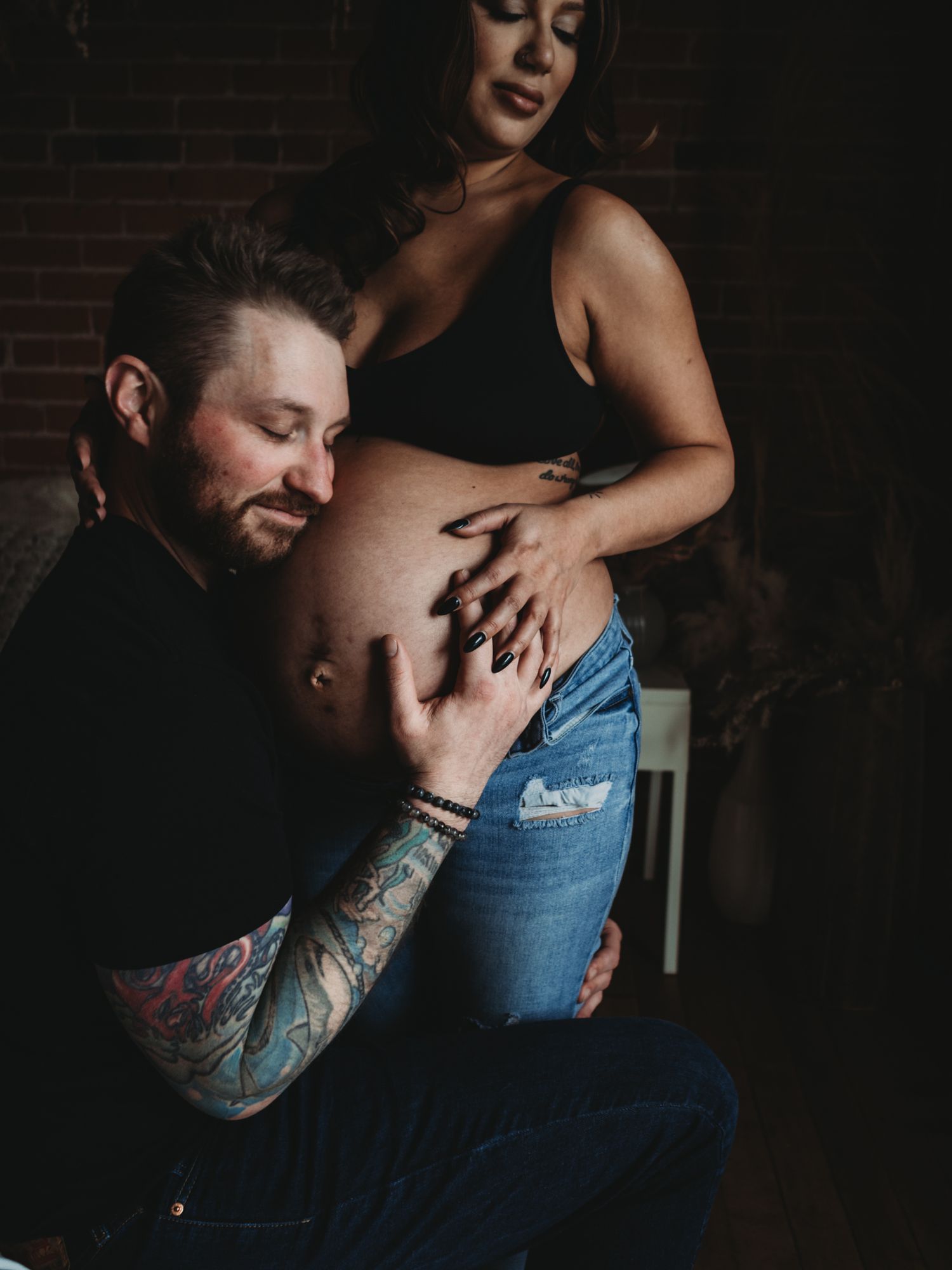 Soft studio maternity portrait with window light