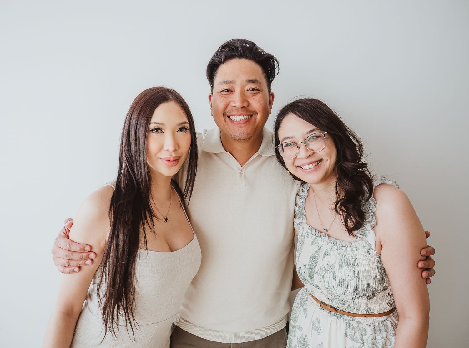 Adult siblings posing together during an extended family photography session in Spruce Grove.