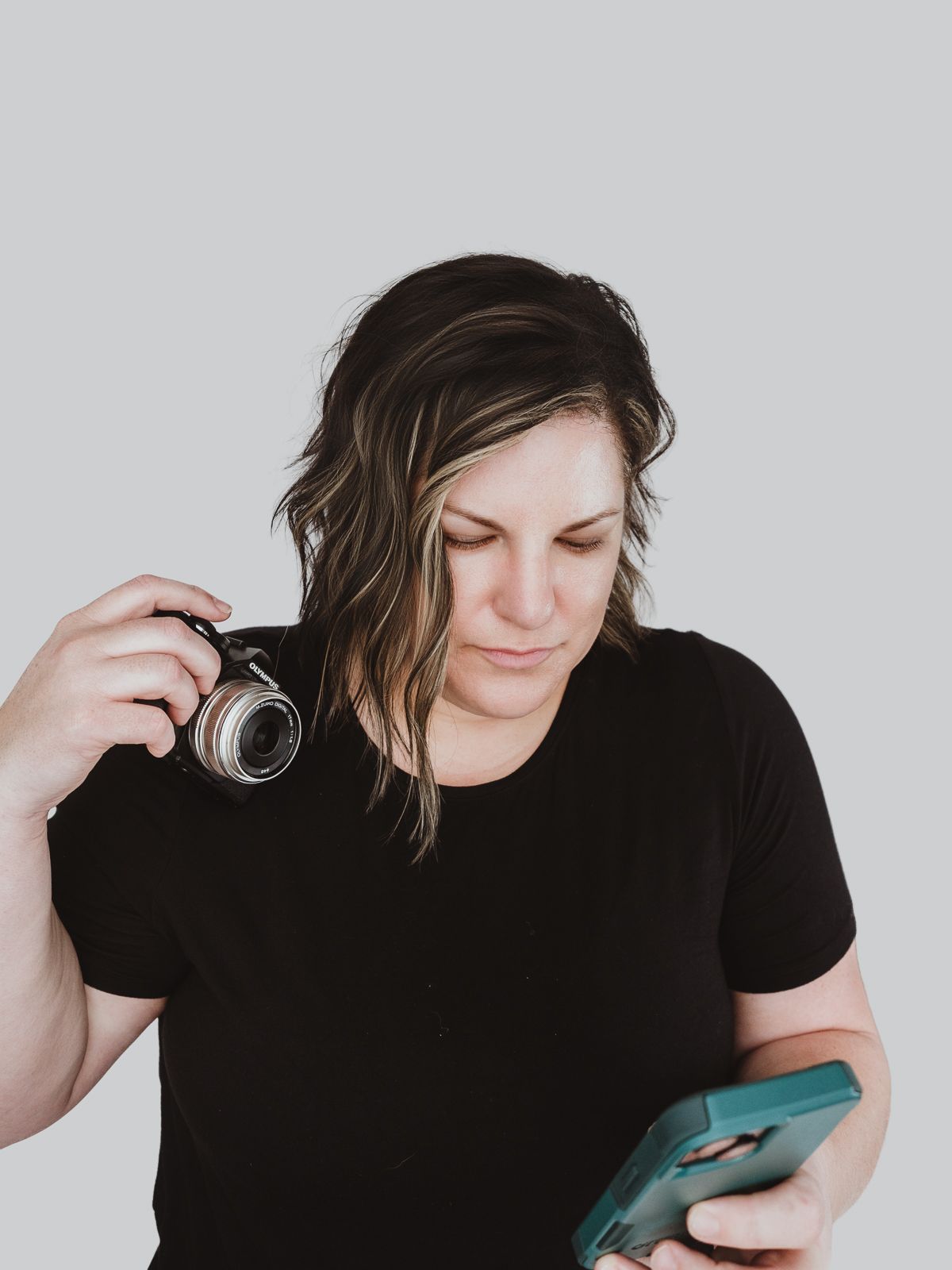 Lifestyle branding portrait of Coral Konanz managing social media and photography business tasks in Alberta.