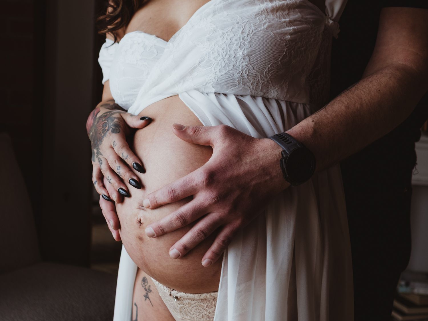 Soft studio maternity portrait with window light