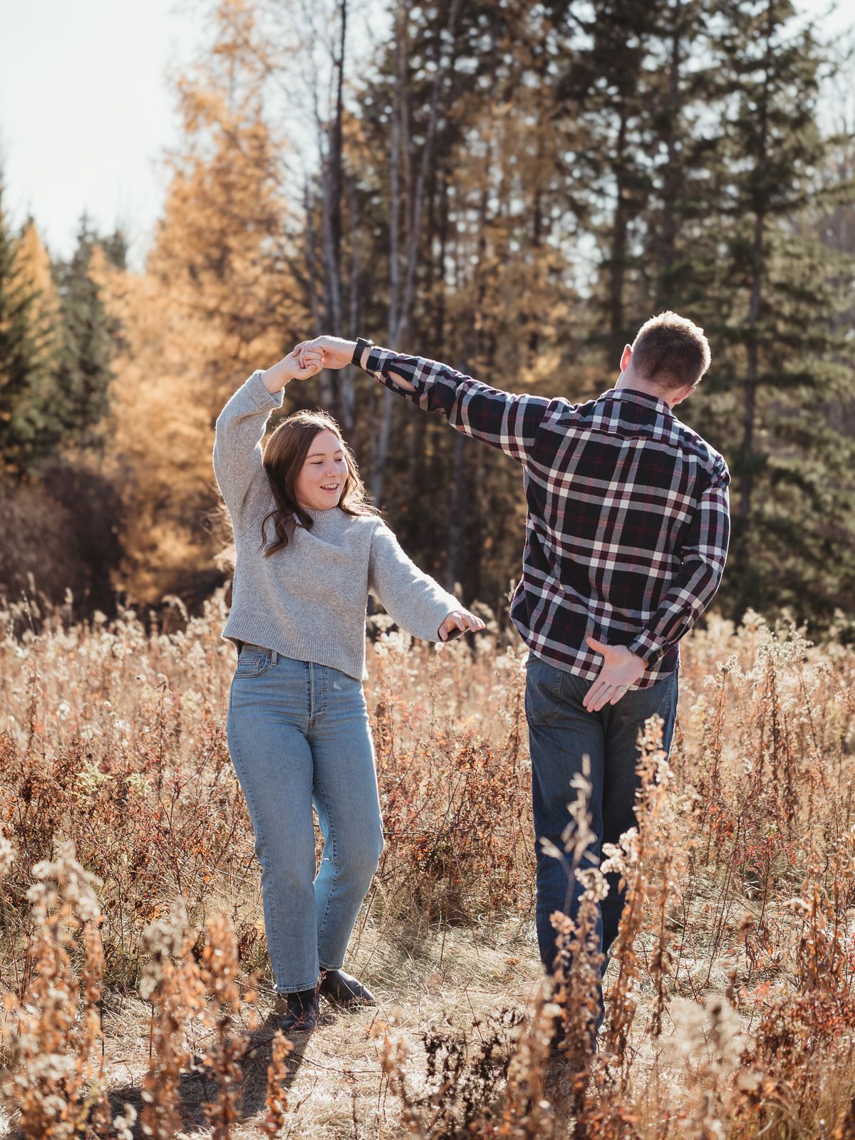 Candid couple dancing during outdoor session
