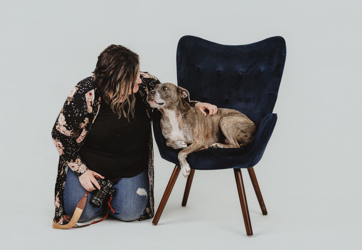 Emotional connection between photographer and rescue dog during a studio pet photography session in the Edmonton area.