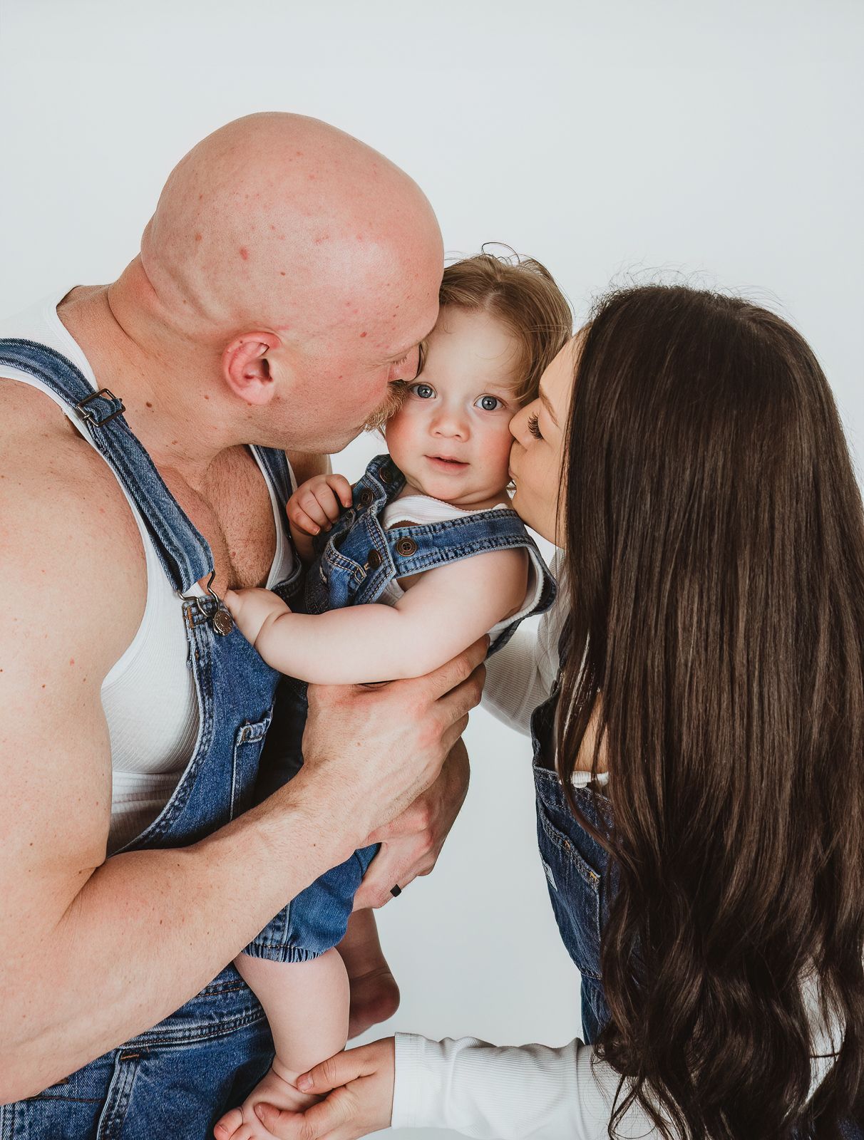Young family with a toddler photographed during a family photography session by a Spruce Grove family photographer.