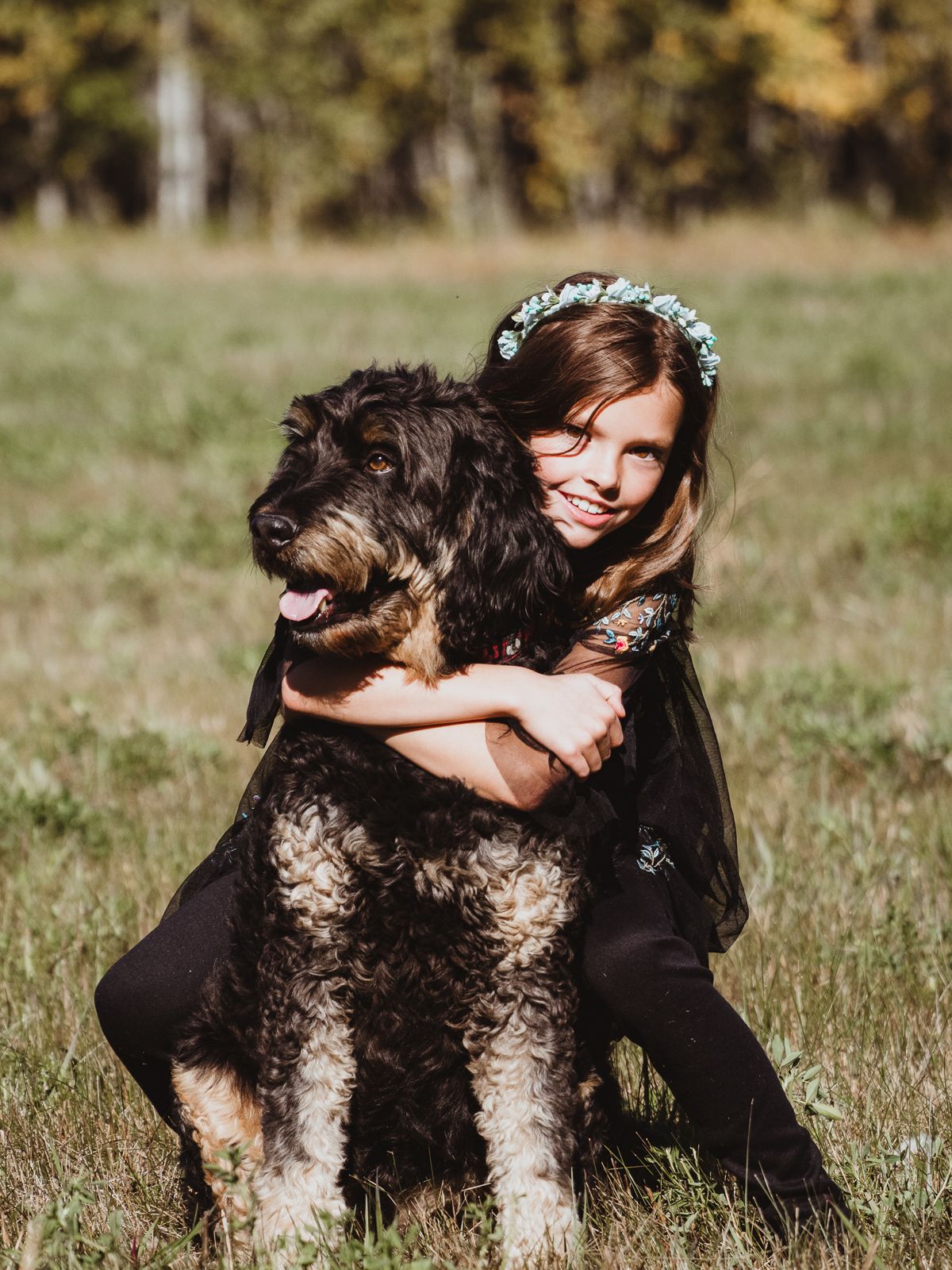 Family with their dog during a pet-friendly fall photography session near Edmonton