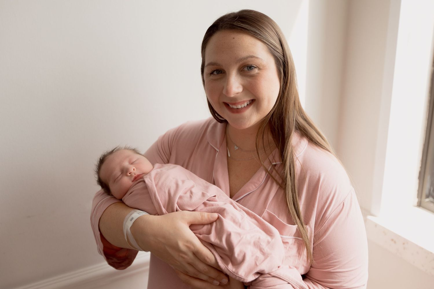 A series of lifestyle photos showing tender moments with a baby in soft pink tones and natural lighting.
