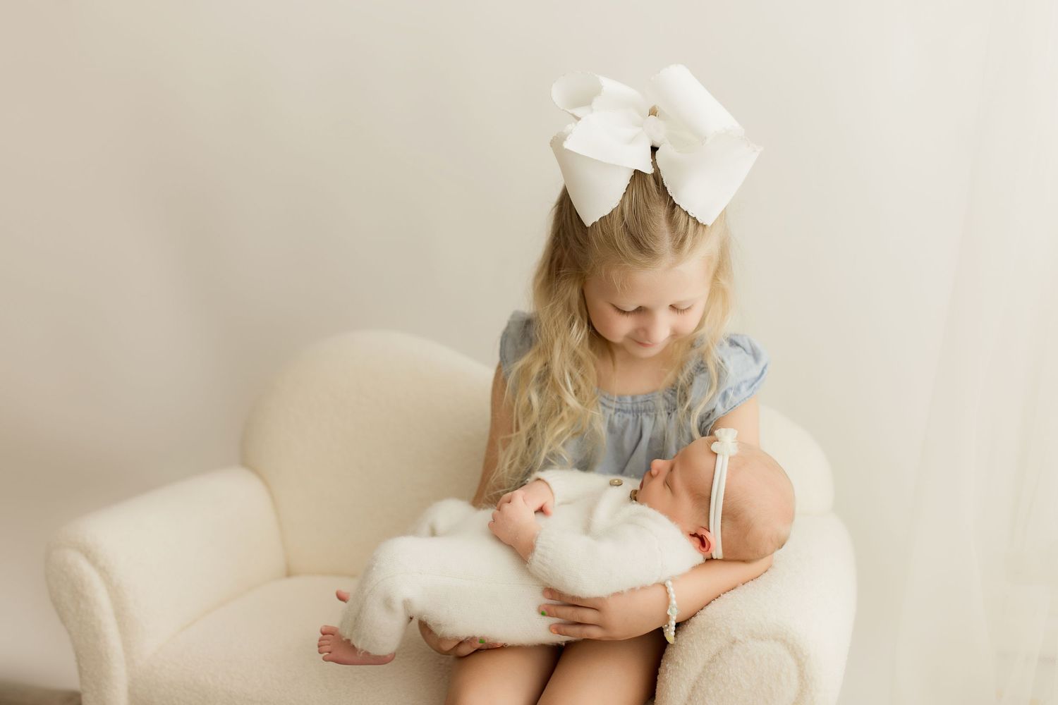 Dreamy lifestyle photoshoot with white plush toys and soft neutral tones.