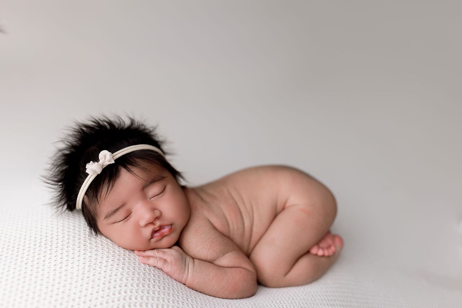 Newborn baby during studio session in Port Neches, TX with Bree Elle Photography.