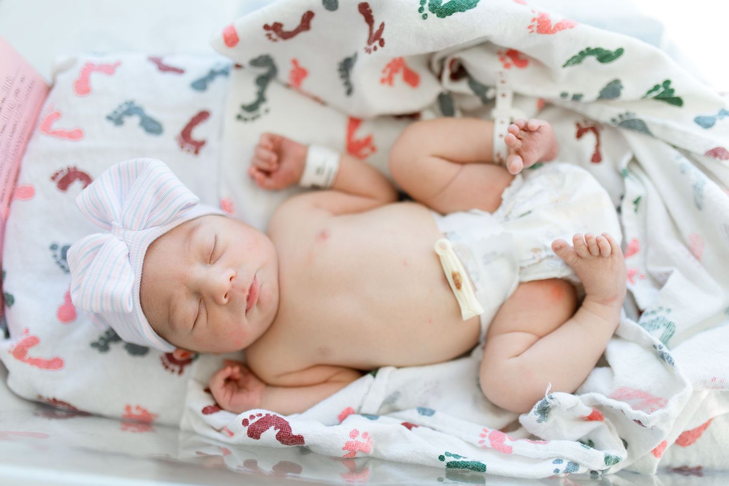 Newborn baby in bassinet during their Fresh 48 session with Bree Elle Photography in Beaumont, TX at St. Elizabeth hospital.