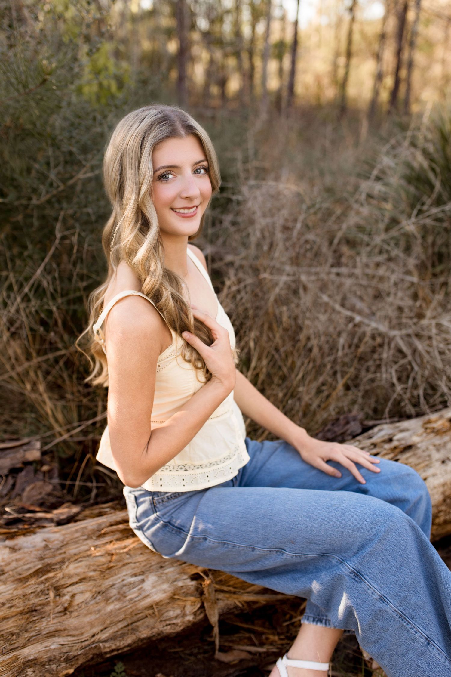 High School Senior taking graduation photos in Silsbee, TX with Bree Elle Photography's associate photographer, Alicia.