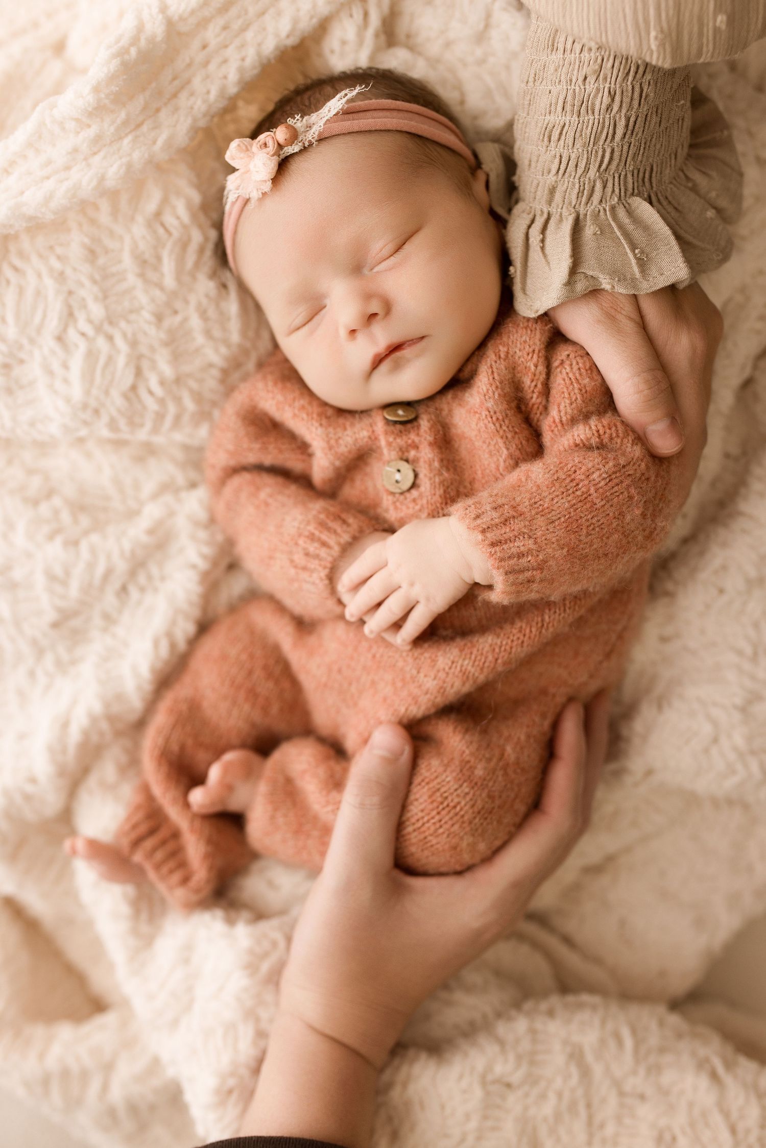 Baby girl during newborn session with Bree Elle Photography in Port Neches, TX studio.