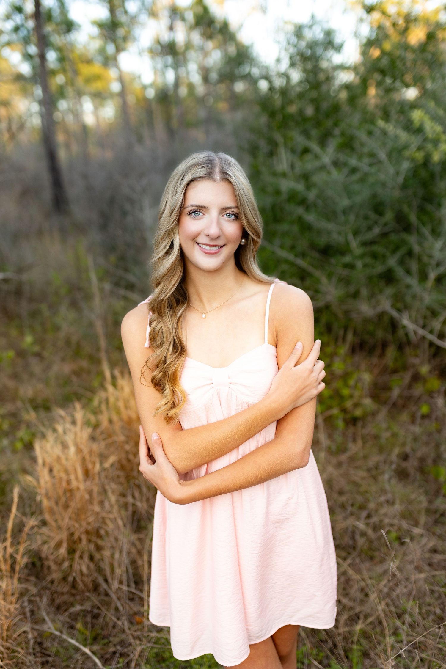 High School Senior taking graduation photos in Silsbee, TX with Bree Elle Photography's associate photographer, Alicia.