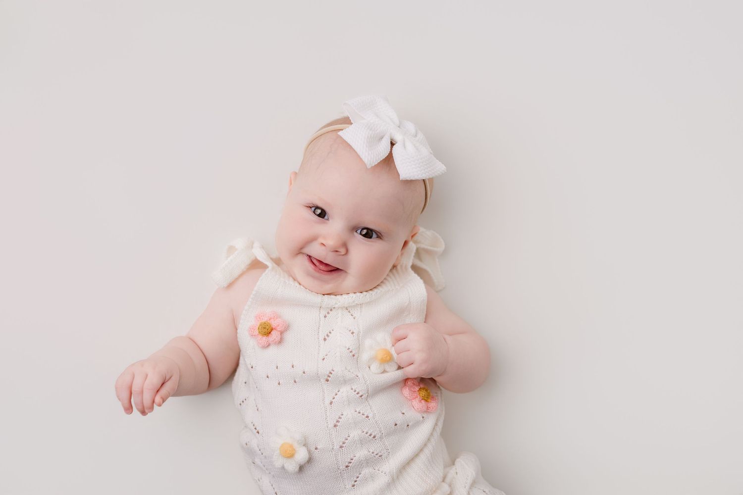 6 month old baby in milestone session with Bree Elle Photography in Port Neches, Tx studio.