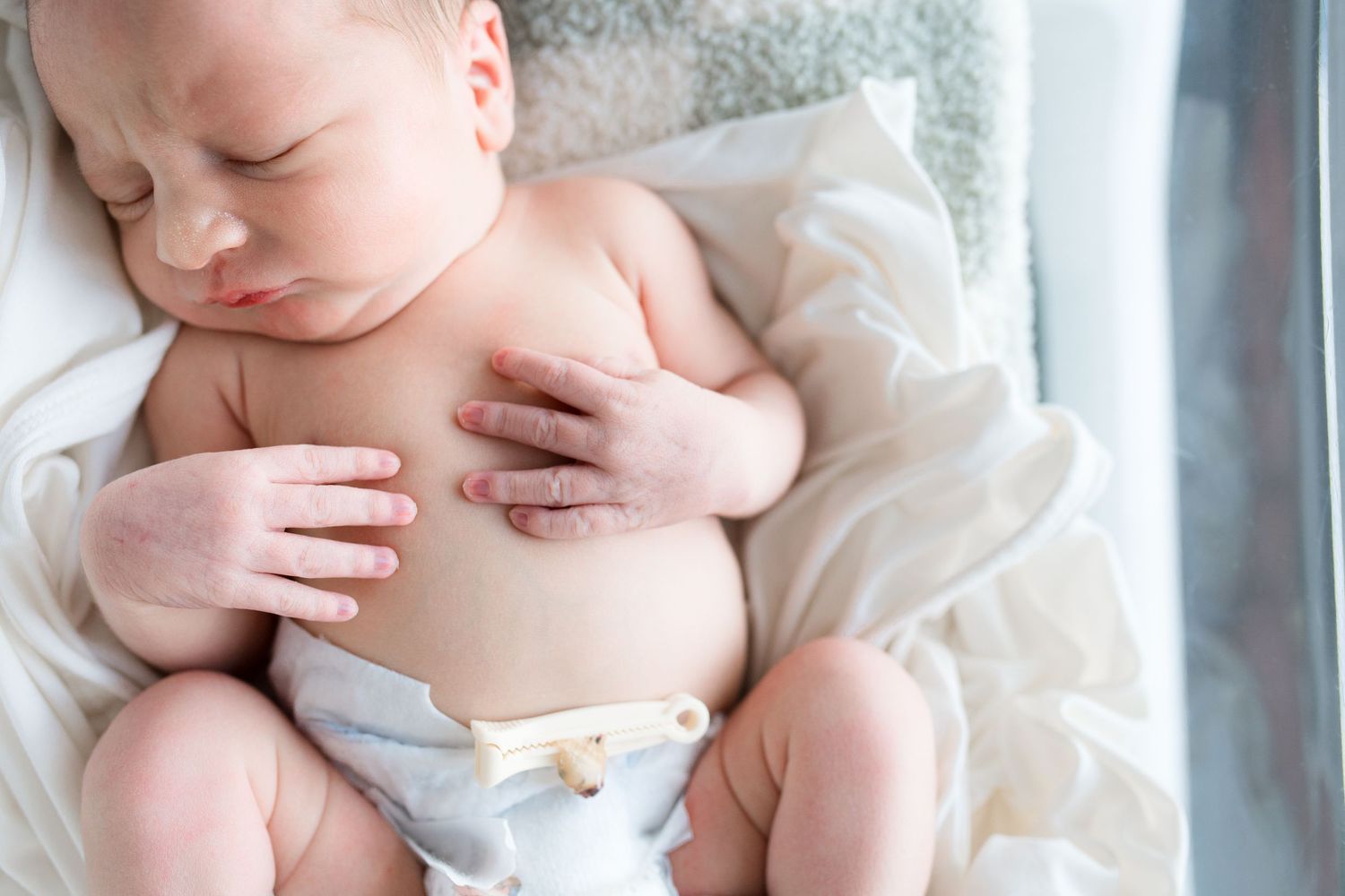 Newborn baby during Fresh 48 session at St. Elizabeth Hospital in Beaumont, TX. Photographed by Bree Elle Photography.