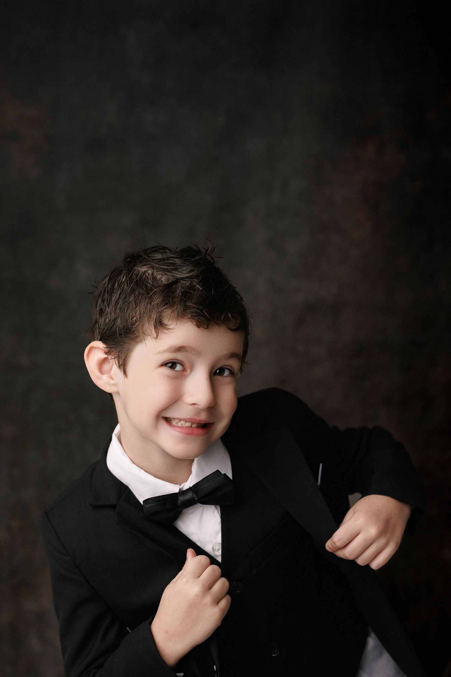 Kinder graduation portrait session with cap and gown in Port Neches, TX with Bree Elle Photography.