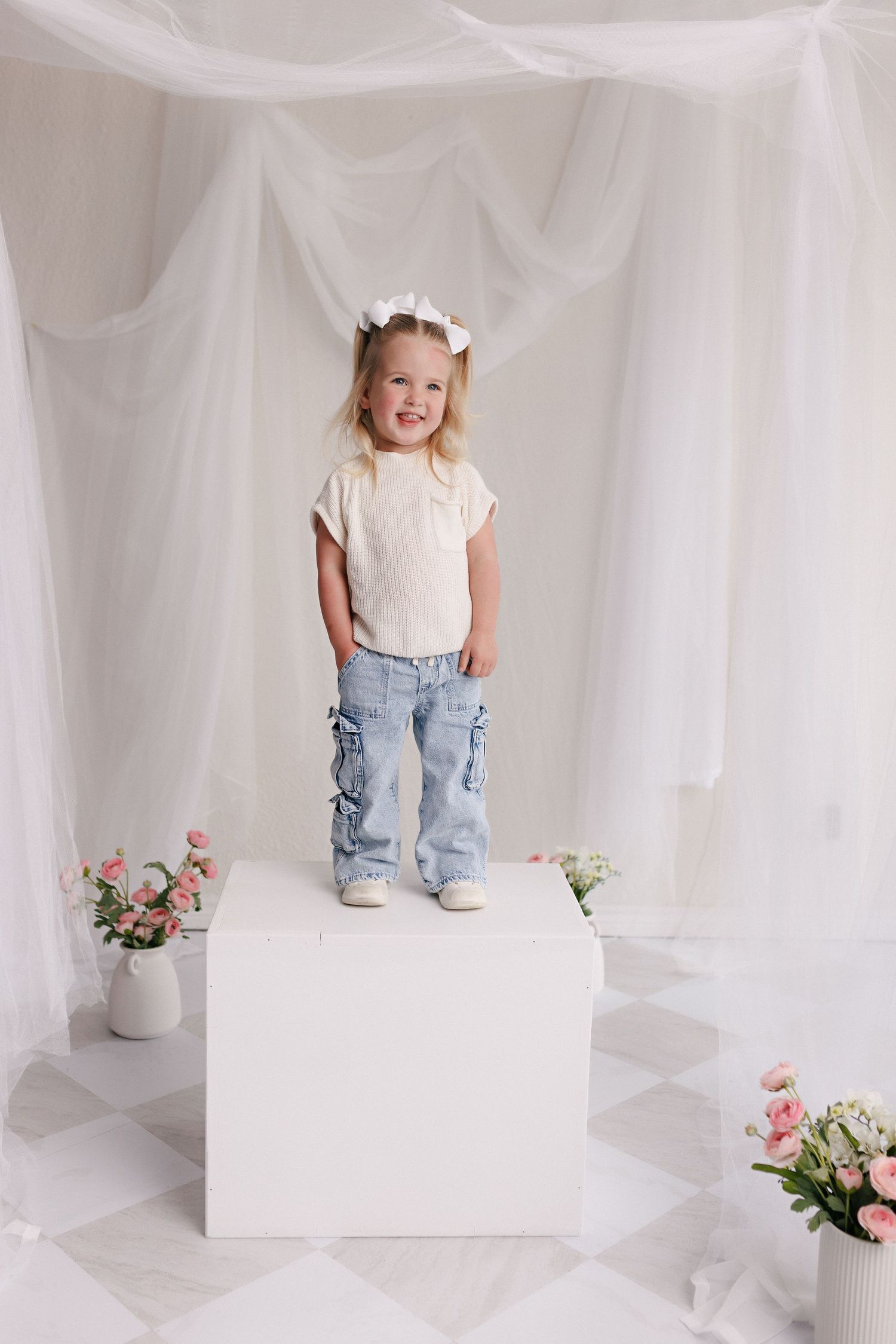 Parent and toddler in matching white tops and jeans during mommy and me session with Bree Elle Photography in Port Neches, TX.