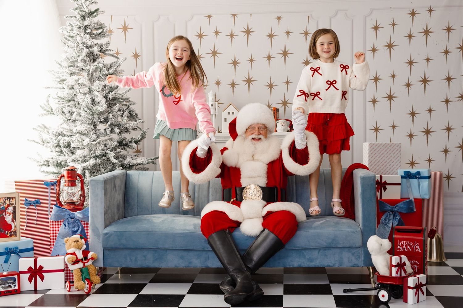 Festive holiday scene with Christmas tree, blue couch, and wrapped presents on a checkered floor.